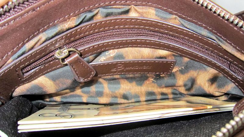  BAG IN CAMOUFLAGE PRINTED LEATHER. THE APPROXIMATE SIZE IS 10X 