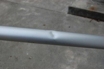 with its original green sleeve outside tube has a minor dent as shown 