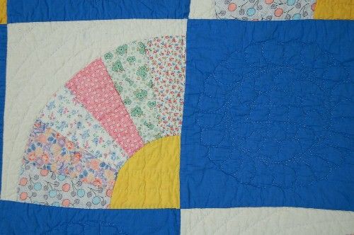 The quilting is SUPERB, with quilting around the piecework and in 